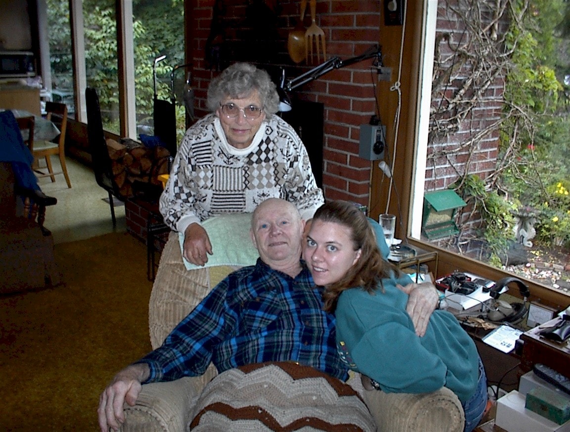 Michelle with Grandma and Grandpa inside the old home