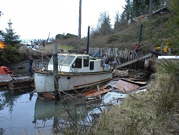 Boat moored at the waterfront during cleanup
