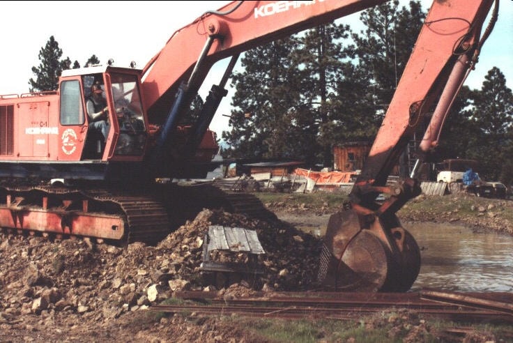 Large Koehring excavator working at a waterfront excavation site